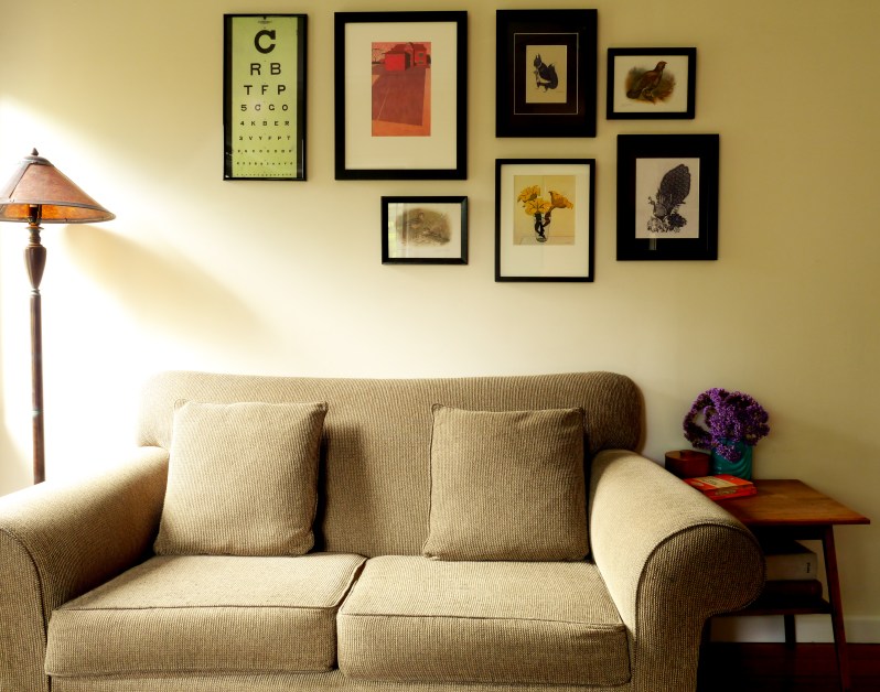 A collection of images including an eye chart purchased from Etsy, Ghostpatrol and Miso print and peacock paper cutting purchased by Jon, on his travels around China.